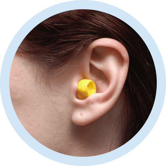 an ear with custom earplugs